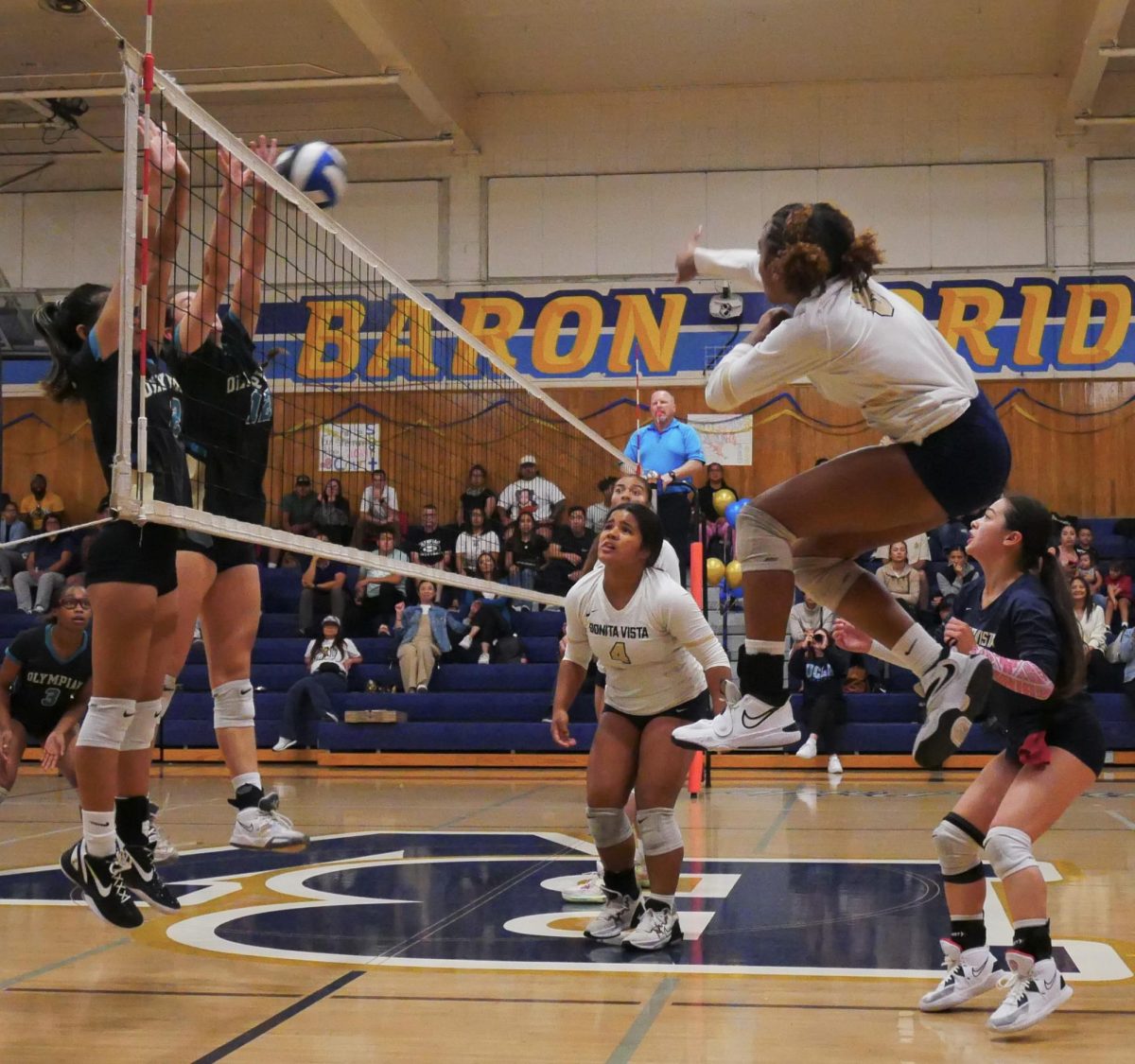 On Oct. 18, the Bonita Vista High (BVH) girls’ varsity volleyball team dominated in the mid and late stages of their 3-1 victory over Olympian High School (OHS). In the first set of the game, which BVH would end up losing, outside hitter, defensive specialist and junior Anay’Ja Ayres (6) captures the attention of her teammates as she swiftly contorts her body while spiking the ball into OHS territory.