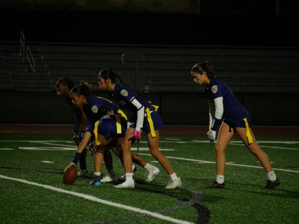 In the Bonita Vista High (BVH) stadium on Nov. 16, girls varsity flag footballs offense prepares for the snap and carry out their play. BVH closes the first half leading 33-0 against Scripps Ranch High.