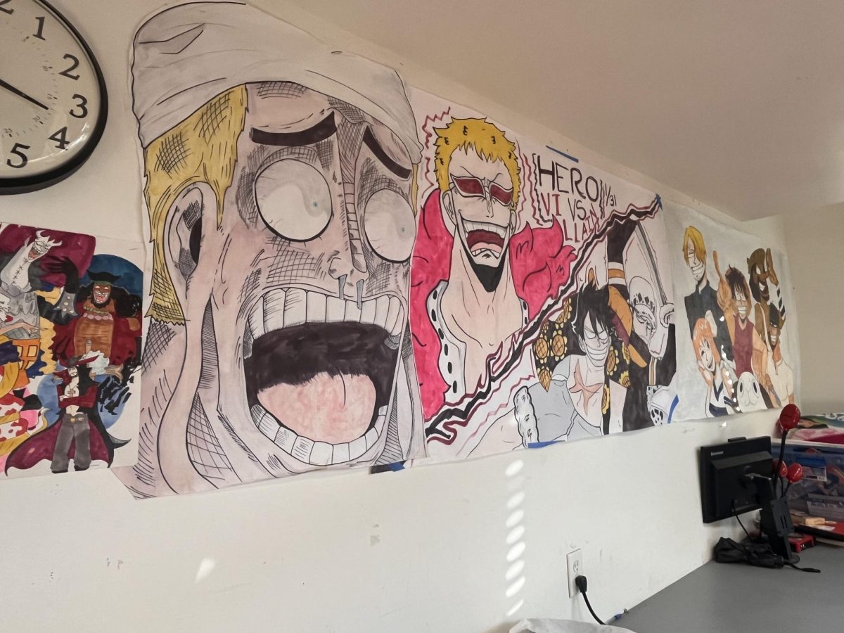 English 9, International Baccalaureate (IB) Literature and English Language Development teacher Raymond Chhan’s classroom features characters from the Japanese Manga series “One Piece.” This was created by his former students along with the various artworks displayed in his room.