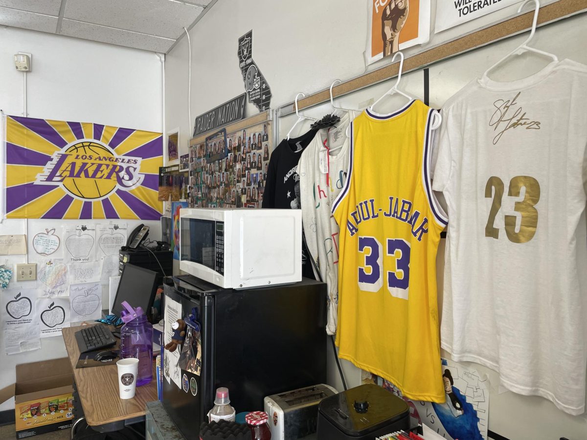In room 705, Expository Reading and Writing English teacher Carmen Stokes displays basketball paraphernalia along her walls. Stokes has been a basketball fan for years, supporting her son Jerry Stokes who plays on Bonita Vista high (BVH’s) varsity basketball team.