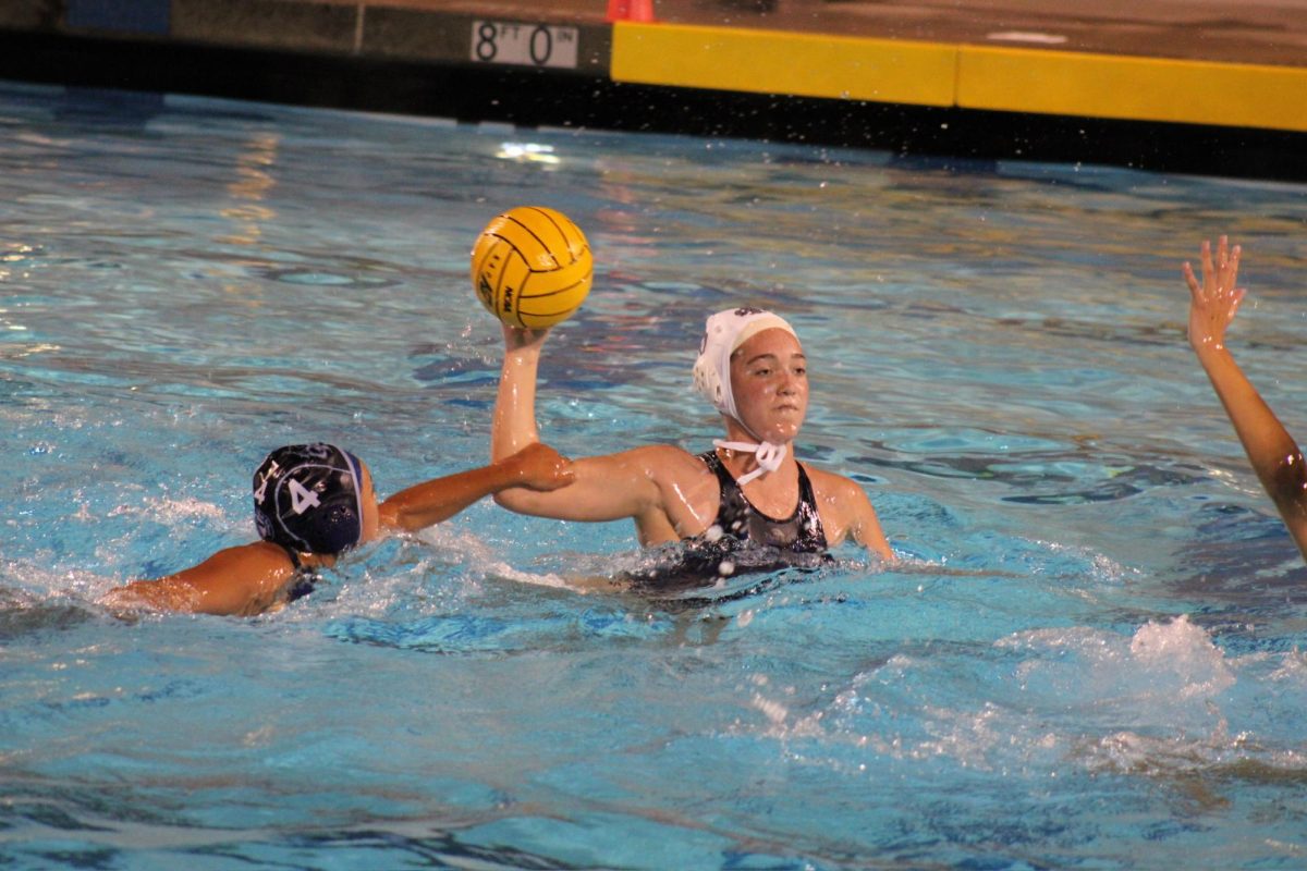 On Jan. 17, the Bonita Vista High (BVH) varsity girls water polo team outplayed Otay Ranch Highs (ORH) lineup in a 22-6 beatdown. BVH captain and senior Bella Kovar (6) winds up her shot into ORH waters, taking a deep breath before launching the projectile. 
