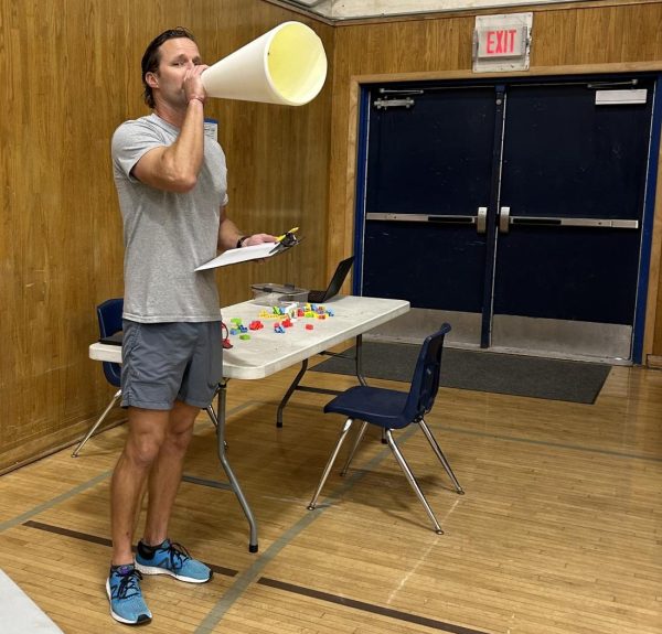 New Bonita VistaHigh (BVH) Physical Education (PE) teacher Daniel Schroeder calls a student to have a discussion during fifth period. As his second official week of teaching he calls his freshman students to learn more about them one on one.