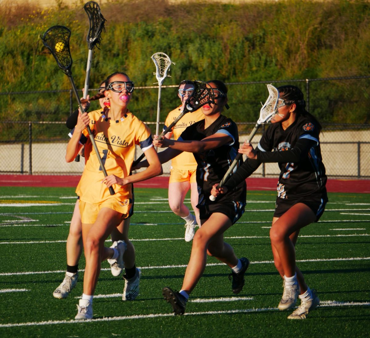 On March 1, the Bonita Vista High (BVH) girls lacrosse team plays against San Ysidro High (SYH). The Lady Barons take the ball and travel downfield in the hopes of scoring.
