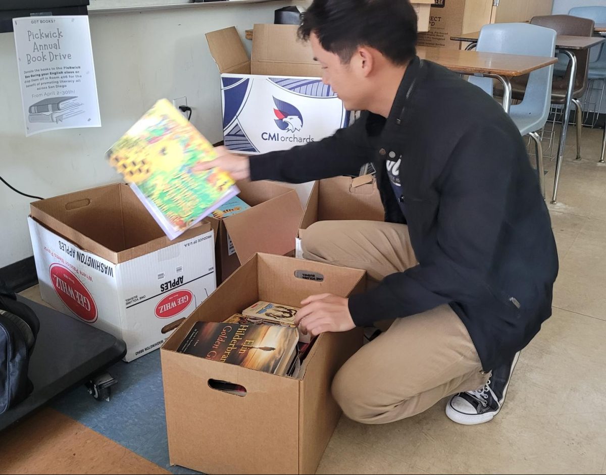 On+April+19%2C+Pickwick+club+advisor+Raymond+Chhan+sorts+the+books+donated+by+students+for+the+Pickwick+club+book+drive.+Throughout+the+month+of+April+students+and+staff+donate+books+to+drop+off+boxes+in+teachers+classrooms%2C+like+Chhans.+The+books+will+be+donated+to+the+San+Diego+Literacy+Council%2C+a+non-profit+organization+that+also+supports+and+advocates+for+literacy+for+all.
