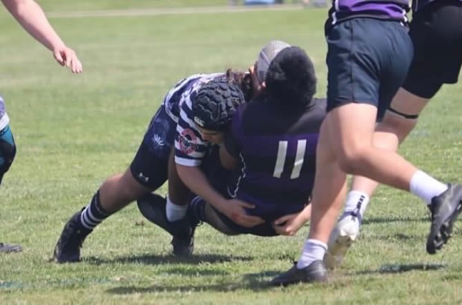 BVH junior and varsity football defensive end Guillermo Smith plays lock for the Old Mission Beach Athletic Club (OMBAC) rugby football club. Smith tackles his opponent to the ground in his OMBAC game on March 9.