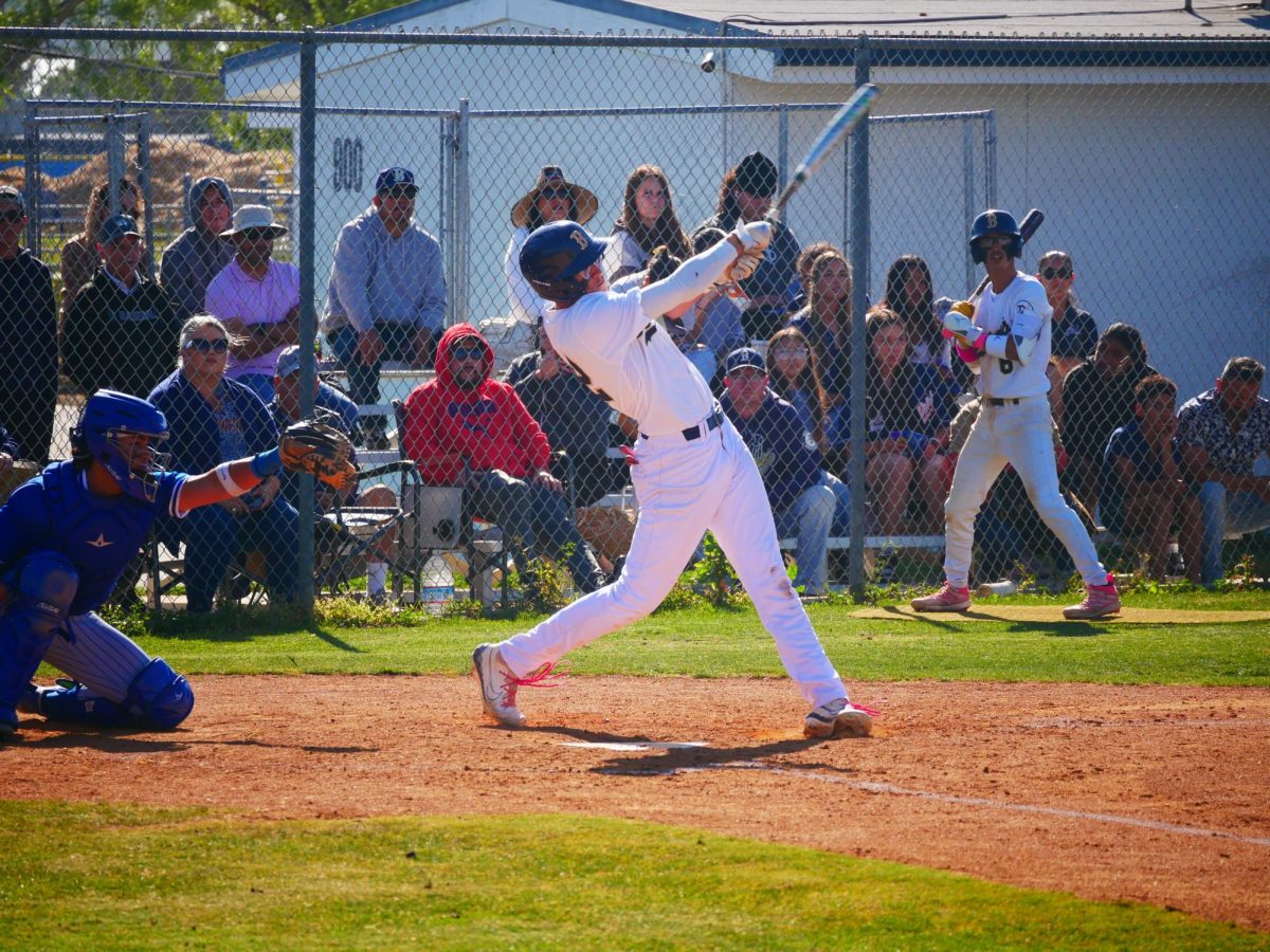 Boys+Varsity+Baseball+batter+for+BVH+Ty+Vann+%2812%29+successfully+hits+the+baseball.+Vann+exerts+force+into+the+swing+to+further+launch+the+ball+through+the+field.
