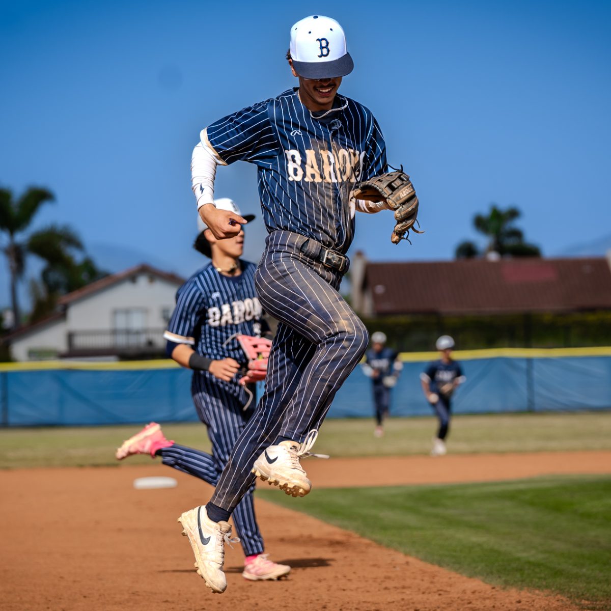 On+May.+2%2C+the+Bonita+Vista+High+%28BVH%29+Barons+boys+varsity+baseball+team+took+on+the+Otay+Ranch+High+%28ORH%29+Mustangs+in+a+twelve+inning+battle%2C+ending+in+a+3-2+victory.+BVH+shortstop+and+senior+Luis+Sosa+%286%29+celebrates+after+the+Barons+take+down+the+Mustangs+in+order+to+end+the+top+half+of+the+inning.+