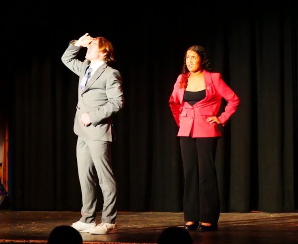 BVH sophomores Mason Markham (left) and Ally Scott (right) perform a duo interpretation for the Speech and Debate showcase on May 10. Markham and Scott are performing a reenactment of a scene from the movie Hidden Figures.
