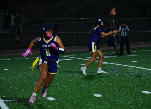 Girls varsity flag football competes against Mission Bay on Aug. 22. Wide receiver ND sophomore Sofia Garay (8) runs a route while quarterback and sophomore Mia Ramirez (6) receives a snap. 