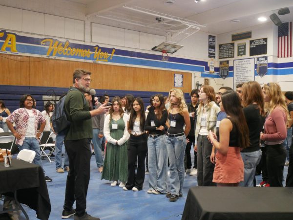 IB students from BVH, Granite Hills, Castle Park, Lacostic Canyon High School and Elementary School, Ocean Knoll are all gathered around the TOK IB Coordinator. They are being informed on how they are going to organize for their TOK.