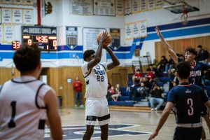 On Jan. 23, 2024, BVH boys' varsity basketball team won Tuesday's home non-conference game against Christian. Junior, now senior, shooting guard, power ford and small ford Aaron Owens attempts a free throw to achieve the ending score of 70-46.