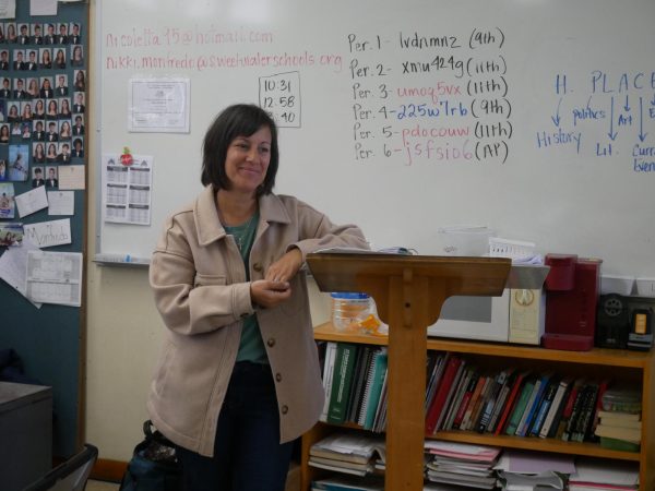 BVH English Accelerated and AP English teacher, Nikki Monfredo is standing front of her second period class. She walks around and watches over and assists the students as they work on their English essays.