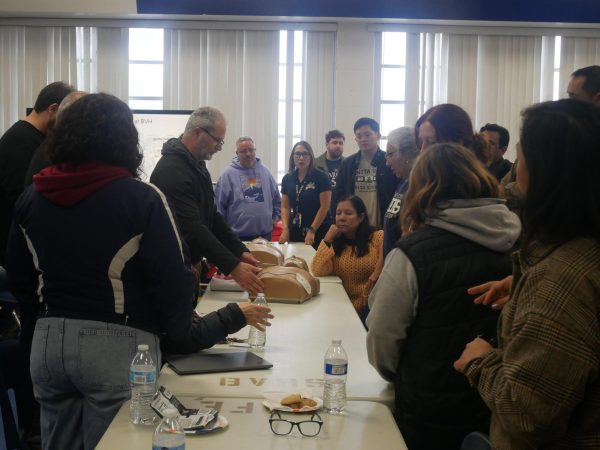 During the BVH staff safety training session on Feb. 7, Beginning art, advanced art and AP drawing teacher Nicolas Brunn demonstrates CPR techniques on a dummy, highlighting the importance of quick response in emergencies. The session also covered proper AED usage
and conducted clear room drills to ensure staff are prepared for various safety scenarios.