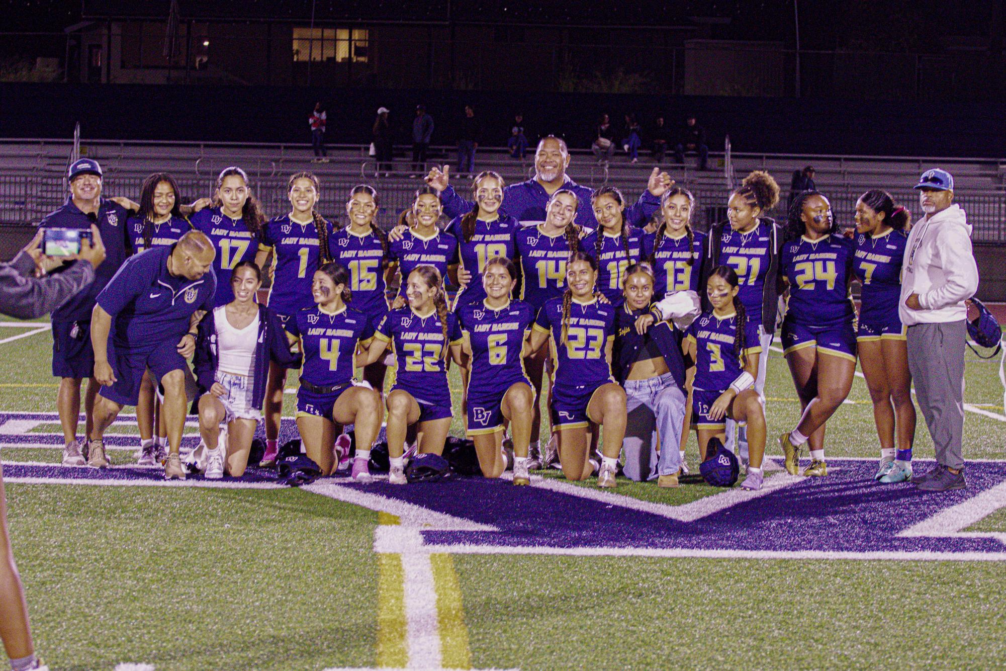 On Oct. 23, the Lady Barons flag football team wins their last season game with a win streak of twenty games. After the match, the team proudly smiles in front of the camera for a bonding photo.