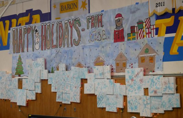 On Dec. 12, banners and posters are seen posted on the gym wall for BVH's winter end-of-year assembly. 