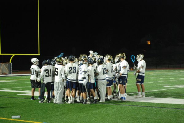 The team huddles together before the game.