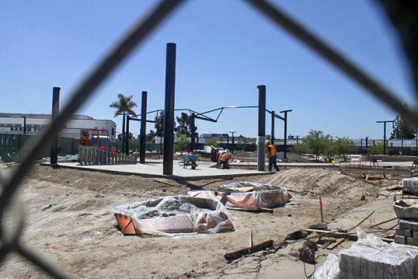 Construction workers work on the quad. Noticeable progress has been made since the start of the construction, with students eagerly anticipating it's completion.