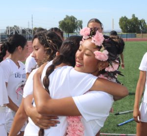 Once the ceremonial walks commenced, Mares rushes to hug junior Kamila Arroyave. All seniors were met with intimate interactions with the underclassmen.