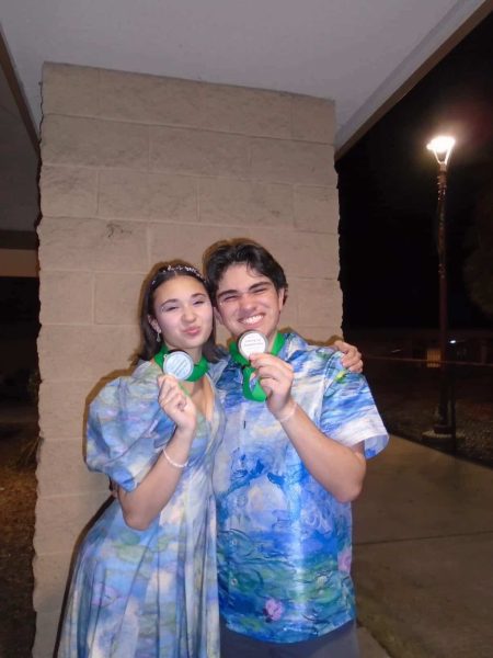 Sophomore Alec Zelaya and junior Dalia Candarlia presenting their VMD medals. Photo provided by Dalia Candarlio.